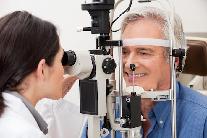 Older man having his eyes examined